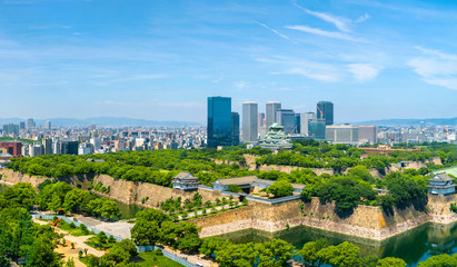 Wall Mural - Aerial view of Castle Park in Osaka, Japan with modern skyscrapers