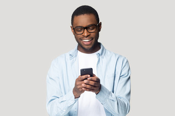 Sticker - Joyful smiling african american young man playing online game.