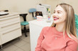 © vfhnb12 - The girl is a blonde with a pleasant smile at the dentist's appointment.