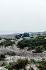 WW2 bunker with graffiti in sand dunes