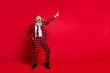 Full length body size view of his he nice attractive trendy crazy cool cheerful cheery white-haired guy dancing having fun clubbing isolated on bright vivid shine vibrant red color background