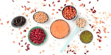 Legumes Panorama, An Overhead Shot On A White Background. Various Pulses. Kidney Beans, Lentils, Soybeans, Chickpeas, A Flat Lay Array
