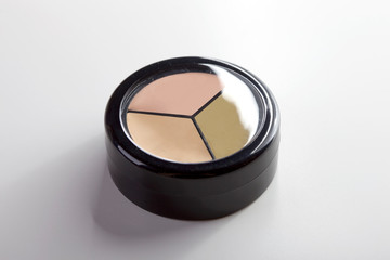 Tri-color concealer. make-up tools and materials. Means for skin toning.