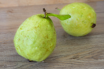 Freshness guava fruit on wooden table.