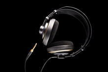 Professional studio headphones and jack on isolated black background