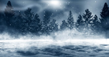 Dark Winter Forest Background At Night. Snow, Fog, Moonlight. Dark Neon Night Background In The Forest With Moonlight. Neon Figure In The Center. Night View, Magic.