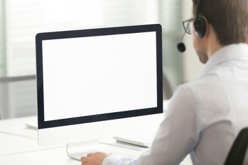 Wall Mural - male call center agent in headset consult client