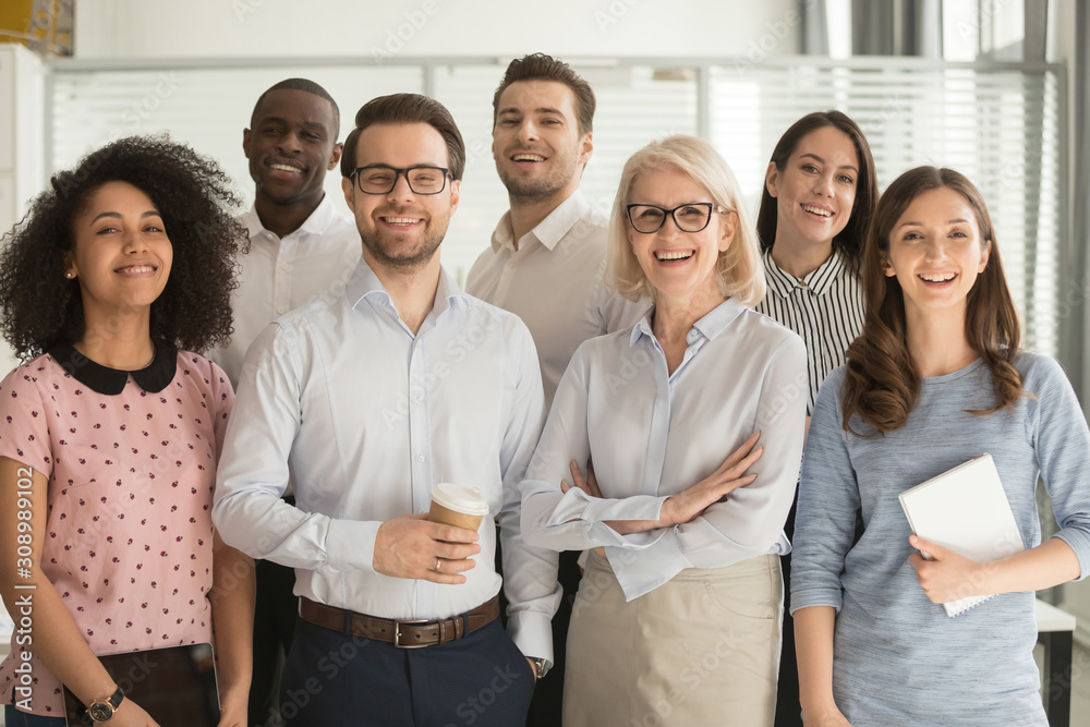 Smiling diverse employees posing for photo in office Stock Photo ...
