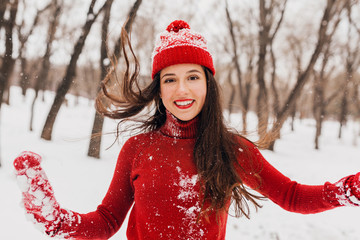 Wall Mural - smiling woman having fun in winter park