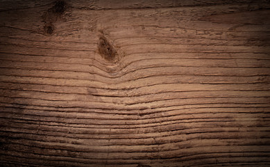 Dark brown grunge scratched wooden cutting, chopping board. Wood texture