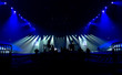 © maxcam - Bright beautiful rays of light on an stage before the concert.