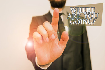 Conceptual hand writing showing Where Are You Goingquestion. Concept meaning used to ask someone the destination headed to Male human with beard wear formal working suit clothes hand