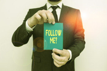 Fototapete - Word writing text Follow Me Question. Business photo showcasing go or come after demonstrating or thing proceeding ahead Male human wear formal work suit office look hold notepaper sheet use hand