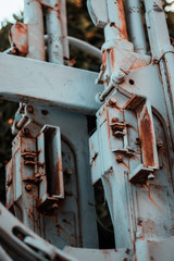 Closeup of a part of an abandoned ruined rusted world war 2 gun, double barrel canons, focus on two ejection ports