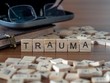 trauma the word or concept represented by wooden letter tiles
