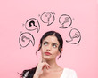 © Tierney - Question marks with speech bubbles with young woman in thoughtful pose
