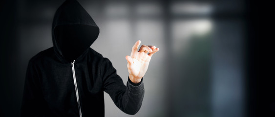 Cybersecurity, computer hacker with hoodie