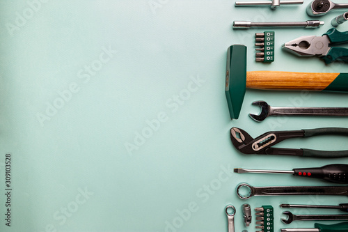 Fotografía Set of tools over blue background, top view with space for text