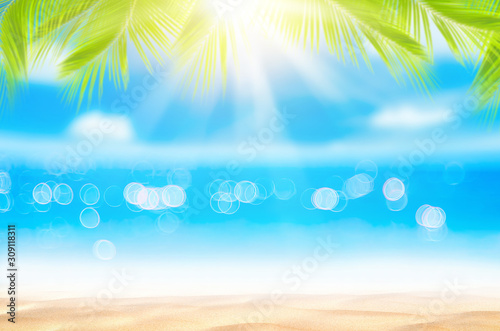 Blur beautiful nature green palm leaf on tropical beach with bokeh sun light ...