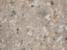 Grinded concrete texture with exposed gravel stones