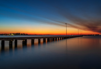 Wall Mural - Smoky sunset at Como Jetty, Perth Australia. Hot Summer Night. Reflections. 