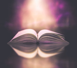 Poster - Stack of books in the library and blur bookshelf background	