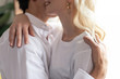 © LIGHTFIELD STUDIOS - Cropped view of man hugging smiling blonde woman