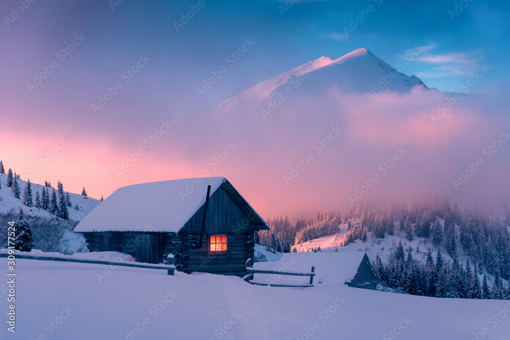 Fantastic winter landscape with wooden house in snowy mountains. Hight ...