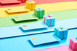 © LIGHTFIELD STUDIOS - multicolored empty credit cards and gift boxes on rainbow background