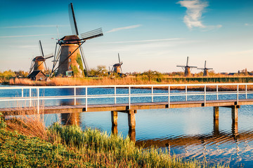 Walking very early, you will not find anyone in Kinderdijk museum. Colorful outdoor scene of Netherlands with famous Dutch windmills. UNESCO World Heritage Site. Traveling concept background.