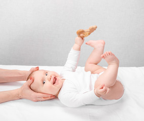 little baby receiving osteopathic treatment of head and neck