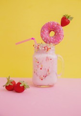 Wall Mural - Delicious dessert strawberry smoothie with pink bagel and cream