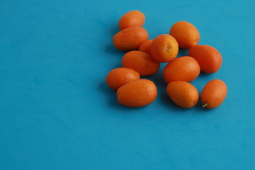 Wall Mural - small and delicious orange fruits kumquat