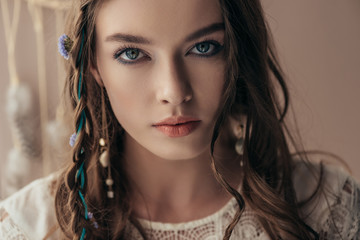 Wall Mural - beautiful tender girl with braids in white boho dress on beige