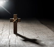 Wooden Cross On Dark Background With Copy Space.