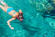 teenage girl enjoy by swimming and snorkeling in Red sea clean water in summer vacation time summer season relaxation background wallpaper picture with empty copy space for your text here