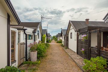 Wall Mural - Picture of Swedish wooden summer houses with entrances