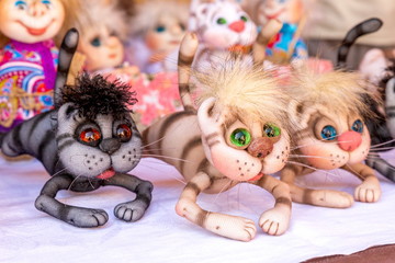 Russia, Samara, August 2019: Sale of soft souvenir toys at the exhibition of masters. Funny kittens.