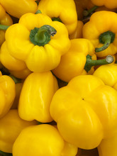Yellow Bell Pepper Background In The Store.