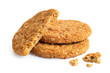 Two and half crunchy oat and wholemeal biscuits with crumbs isolated on white.
