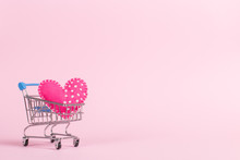 Red Heart As A Symbol Of Love, In A Shopping Trolley, The Concept Of Buying Heart For Money For Valentine's Day. Commercial Promotion, Copy Space.