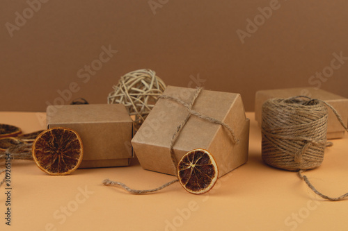 Download Christmas Craft Gift Boxes Balls From Vine And Slice Of Dry Orange On Pastel Sand Color Background Buy This Stock Photo And Explore Similar Images At Adobe Stock Adobe Stock Yellowimages Mockups