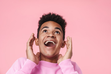 Wall Mural - Portrait of a smiling african teenager boy wearing pullower