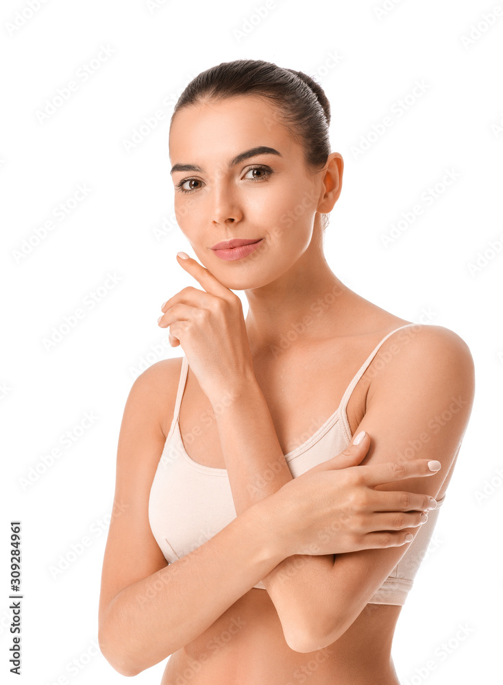 Beautiful young woman in underwear on white background