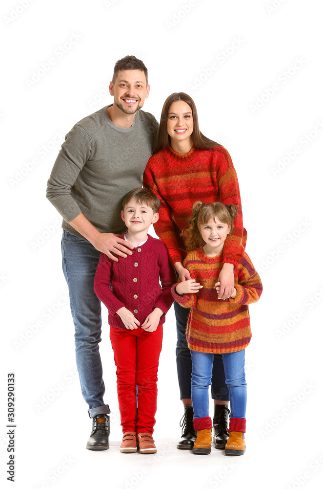 Happy family in winter clothes on white background