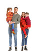 © Pixel-Shot - Happy family in winter clothes on white background