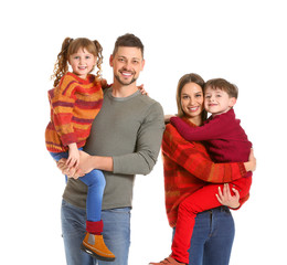 Canvas Print - Happy family in winter clothes on white background