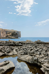 Wall Mural - blue seascape with cliff at limestone coastline in malta 