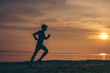 © Chanchai - The man with runner on the  be running for exercise.Fit runner fitness runner during outdoor workout with sunset background