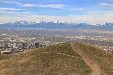 Wall Mural - Hikers enjoy view of the snowcapped Oquirrh mountains on the foothills of the Wasatch range near Salt Lake City